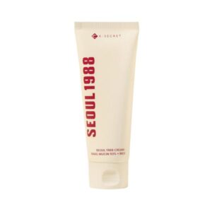K-Secret Seoul 1988 Cream : Snail Mucin 93+Rice in a jar on a neutral background.