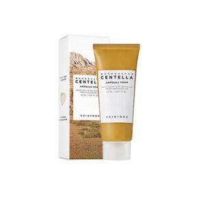SKIN1004 Madagascar Centella Ampoule Foam Cleanser in a bottle with foam texture.