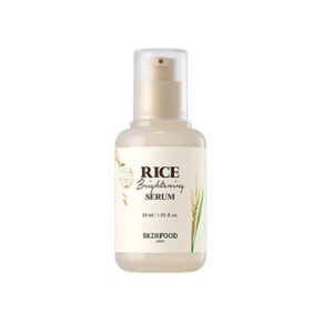 Skinfood Rice Brightening Serum bottle on a soft background.